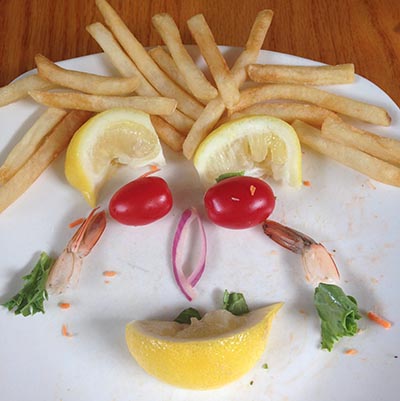 A smiling face crafted from food